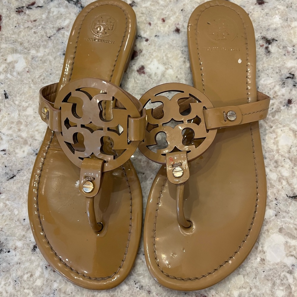 Well loved size 8 tan Tory Burch flip flops